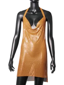 Close-up detail of the gold metallic mesh halter dress with sparkling sequin finish