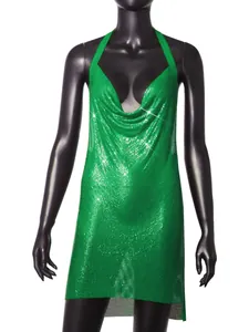 Detailed view of a sparkling green metallic mesh halter mini dress on a mannequin.