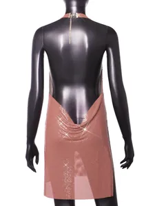 Back view of a rose gold metallic sequined halter dress with a deep V backless design