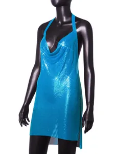 Close-up of shimmering turquoise metallic sequin halter dress on a black mannequin