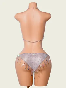 Close-up of silver sequin bikini body chain set featuring elegant dangling star tassels