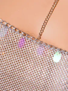 Close-up detail of silver rhinestone mesh chest chain with colorful sequins