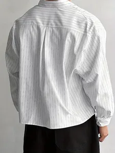 Detailed back view of a men's loose long-sleeve white shirt featuring thin vertical stripes