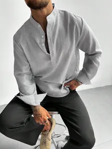 Detailed view of men's grey striped shirt featuring a mandarin collar and textured fabric