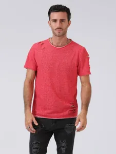 Professional studio shot of a red short sleeve T-shirt featuring stylish ripped details on model