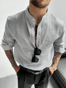 Detail view of a men's grey striped seersucker shirt with a stylish grandad collar