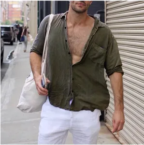 Detail view of men's olive green cotton linen shirt with chest pocket and lapel
