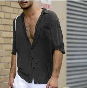 Detailed macro shot of a men's charcoal cotton linen shirt featuring a functional chest pocket