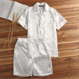 Close-up detail of the smooth white satin men's pajama set with shirt and shorts set