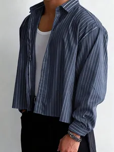 Close-up of men's loose navy blue pinstripe long sleeve shirt for a casual look