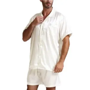 Elegant men's silky solid white pajama set featuring a short sleeve button-down shirt and shorts