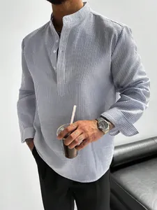 Detail of men's striped shirt with mandarin collar and textured fabric finish