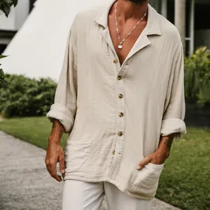 Close-up of a men's beige cotton linen beach shirt featuring a button-down front and pockets.