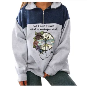 Close-up of women's quarter-zip sweatshirt featuring detailed dragonfly and floral print