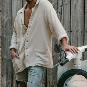 Close-up of casual men's beige cotton linen shirt showing button detail and texture