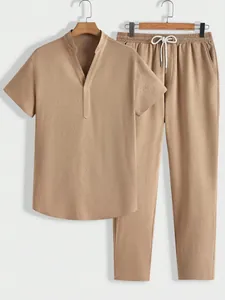 Men's casual 2-piece set with short sleeve top and long pants in textured tan fabric.