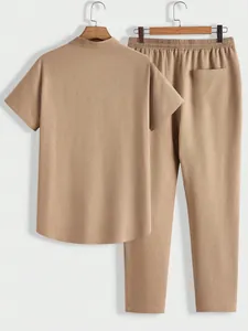Men's solid color casual set featuring a textured short sleeve shirt and matching pants
