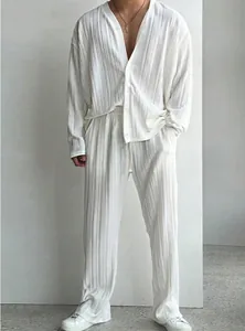 Macro view of white pleated fabric texture on men's casual shirt and trousers set