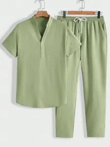 Detailed texture of men's casual two-piece set in light green summer fabric