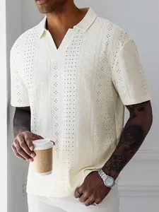 Close-up detail of beige knit hollow jacquard fabric on a men's summer polo shirt