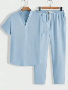 Light blue men's casual set with textured fabric showing short sleeves and pants
