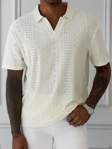 Detail view of men's cream knitted hollow-out polo shirt with intricate jacquard texture.