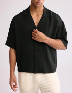 Men's casual black short-sleeved shirt featuring revere collar and premium waffle texture
