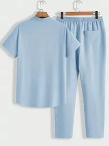 Men's light blue casual set featuring short sleeve shirt and textured long pants