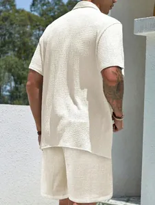 Detailed back view of men's summer casual set featuring textured beige short sleeve shirt
