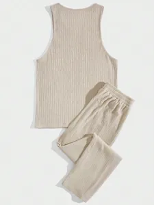 Detailed macro view of beige men's two-piece lounge set with textured crinkle fabric
