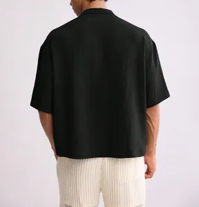 Rear view of black loose men's shirt showing high-quality waffle texture detail
