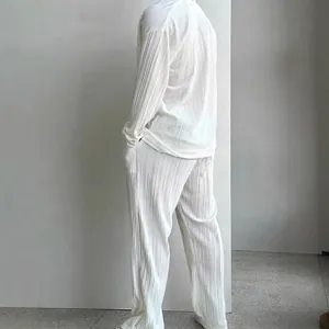 Elegant men's white pleated two-piece set with long sleeve shirt and casual trousers