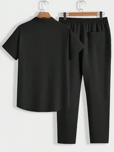 Men's casual two-piece suit with short sleeve shirt and trousers in black crinkle fabric