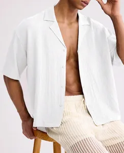 Men's loose white short sleeve lapel shirt featuring high-quality textured seersucker fabric.