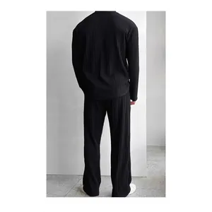 Men's minimalist black pleated two-piece set with long sleeve shirt and trousers