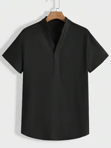 Detail view of a men's black textured short-sleeved shirt with a casual Henley V-neckline