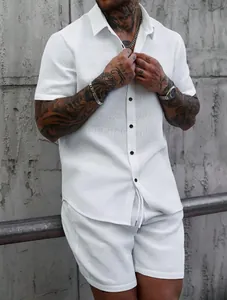 Detailed view of white jacquard texture on men's summer shirt and shorts leisure set