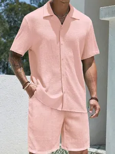 Close-up of pink waffle texture fabric on men's summer short sleeve shirt and shorts set