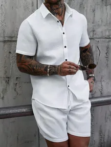 Detail view of white jacquard textured men's summer short sleeve shirt and shorts set