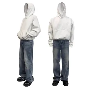 Detailed front and side view of white boxy oversized hoodie paired with blue washed jeans