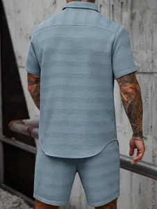 Detailed back view showing the unique textured waffle knit fabric of this men's blue set