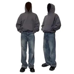 Heavyweight charcoal gray boxy hoodie with dropped shoulders and oversized streetwear fit.