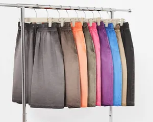Macro view of multi-colored retro washed gradient shorts hanging on a rack