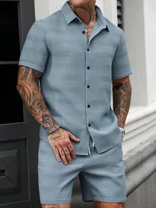 Close-up of men's blue jacquard shirt and shorts set showing waffle texture detail