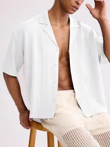 Stylish men's loose casual white short sleeve shirt with textured fabric and lapel collar