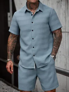 Detail view of light blue textured jacquard short-sleeve shirt and shorts set for men