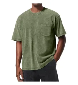 Close-up of vintage washed green pocket T-shirt with oversized fit and dropped shoulders