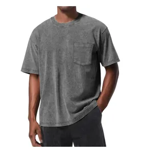 Close-up of a vintage washed grey t-shirt featuring an oversized fit and chest pocket detail