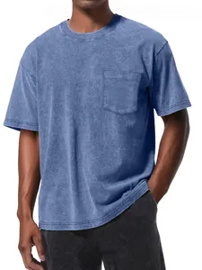 Close-up detail of a vintage washed blue oversized T-shirt featuring a chest pocket design