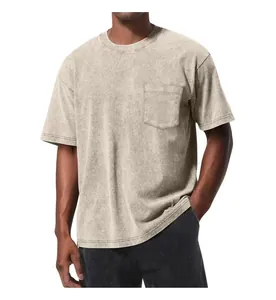 Detail of vintage acid washed oversized pocket T-shirt with drop shoulder.